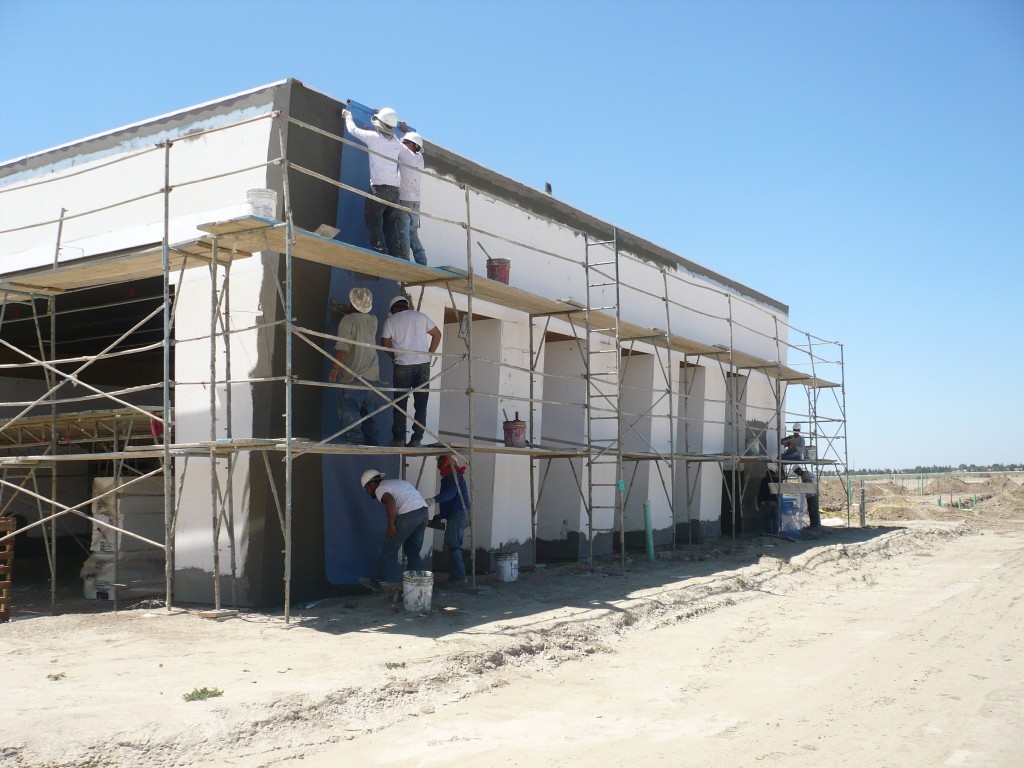 Sweaney applied a Dryvit standard PB EIFS system with a Sandblast finish over 900 sheets of 5/8″ Dens-glass sheathing.